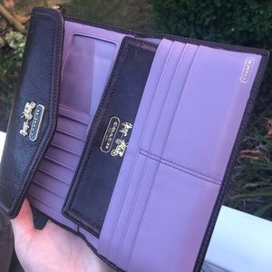 brown and light purple leather coach wallet